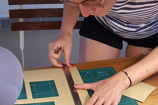 Discover Leather Workshops Experience in Old Town Hoi An - Punching holes is the hands-on highlight