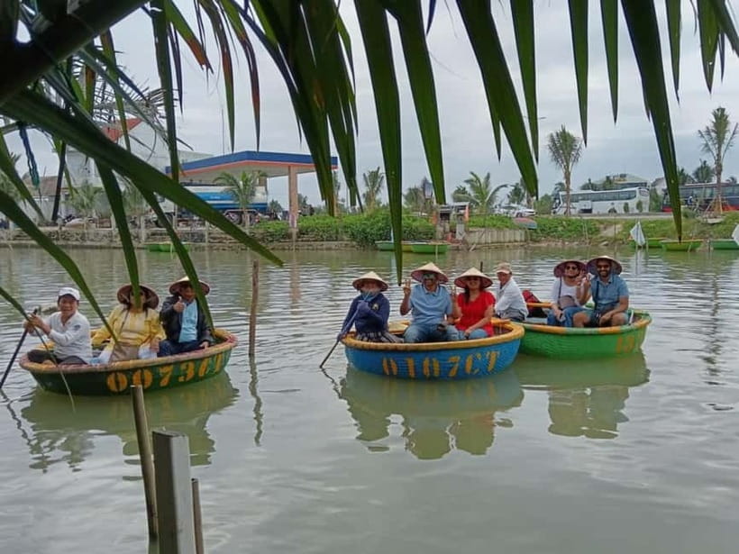 Hoi An: Countryside Biking Sighseeing & Basket Boat Ride - Working the gardens at Tra Que