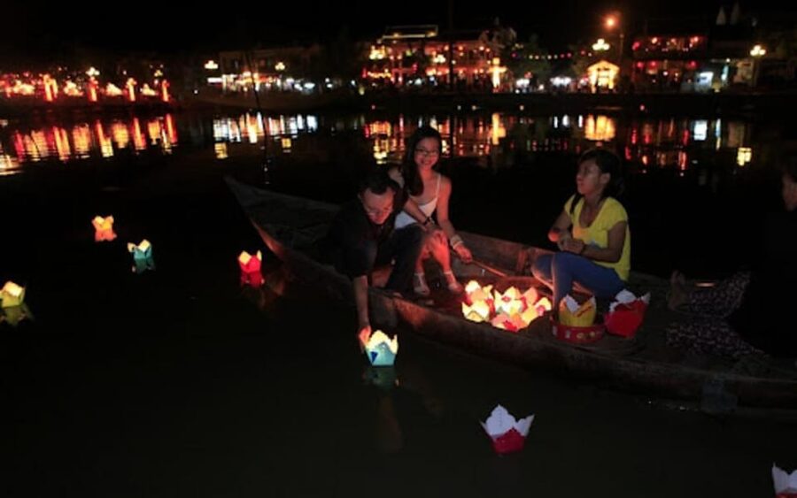 Hoi An: Hoai River Night Boat Trip and Floating Lantern - Lighting the flower lantern and making a wish