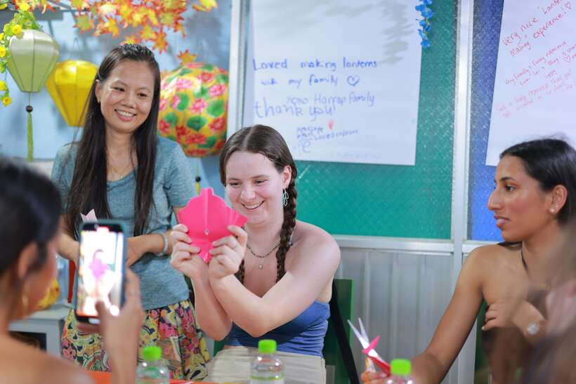 Hoi An : Lantern Boat Ride & Flower Lantern Making Class. - A wooden boat ride after sunset