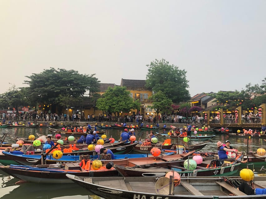 Hoi An Lantern Boat Ride on the Thu Bon River - Lighting your flower lantern and making a wish