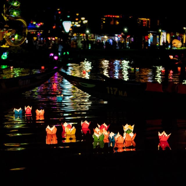 Hoi An Lantern Boat Ride on the Thu Bon River - Watching Hoi An reflect on the water