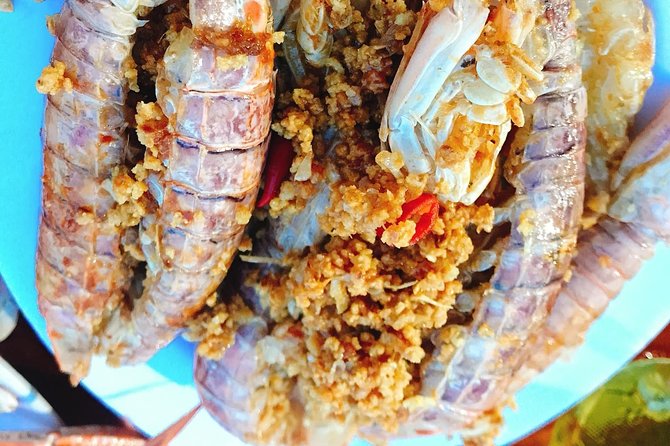 Hoi An Nightlife And Food Tour By Electric Scooter - Seafood and a Restaurant with a Purpose